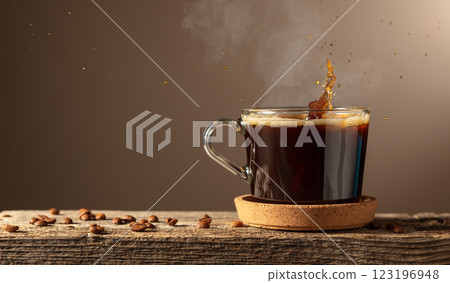 Black coffee in glass cup on a brown background. 123196948