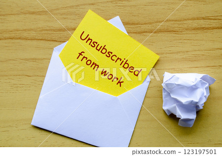 Unsubscribed from work text on yellow paper in an envelope. Resignation concept. 123197501