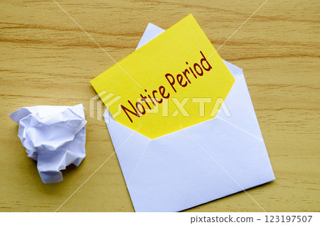 Top view of Notice Period text on yellow paper in an envelope. Resignation concept. Top view of Notice Period text on yellow paper in an envelope. Resignation concept. 123197507