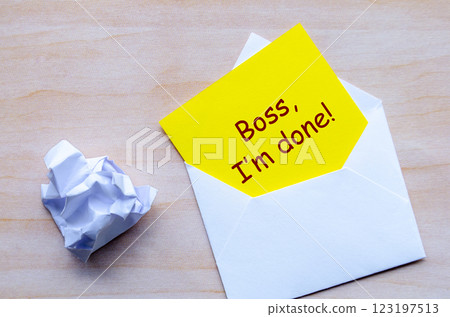 Boss, I am done text on yellow paper in an envelope. Resignation concept. Boss, I am done text on yellow paper in an envelope. Resignation concept. 123197513