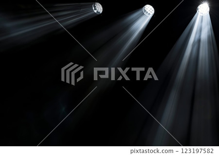 Dramatic stage spotlight illumination with three beams in dark setting 123197582