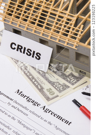 Unfinished small house, mortgage agreement form, dollars and work tools 123198225