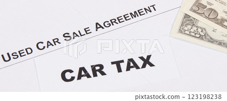Inscription car tax, dollar banknotes and vehicle sales agreement 123198238