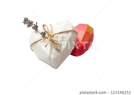 Organic handmade soap in the shape of a heart with natural ingredients, top view. Organic handmade soap in the shape of a heart with natural ingredients, top view. 123198252
