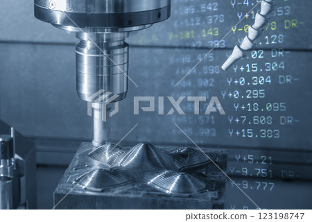 Abstract scene the CNC milling machine rough cutting the injection mold parts and G-code data background. Abstract scene the CNC milling machine rough cutting the injection mold parts and G-code data background. 123198747