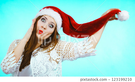 Funny woman in Christmas Santa hat Funny woman in Christmas Santa hat 123199210
