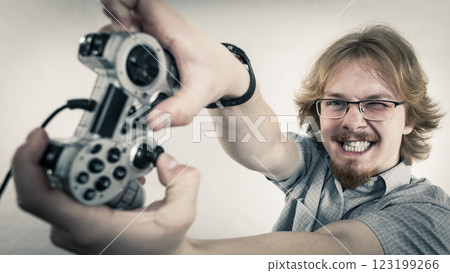 Gamer man holding gaming pad 123199266