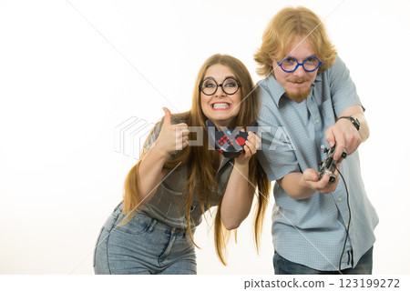 Gaming couple playing games Gaming couple playing games 123199272