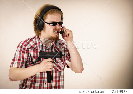 Gamer man shooting from gun Gamer man shooting from gun 123199283