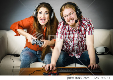 Gaming couple playing games 123199284