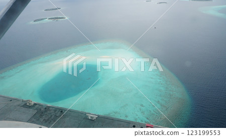 Flying over tropical atoll in maldives archipelago 123199553