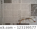 English newspaper and glasses (bottom right, diagonal) 123199577