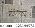 English newspaper and glasses (side, center) 123199578