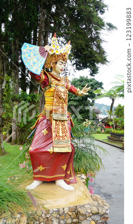 A colorful statue beautifully showcasing traditional dance attire in Ulun Danu Beratan Temple 123199883