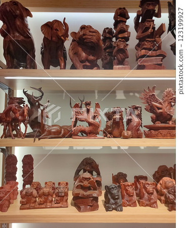 Bunch of handmade wood crafted souvenirs figurines of Balinese traditional style Bunch of handmade wood crafted souvenirs figurines of Balinese traditional style 123199927