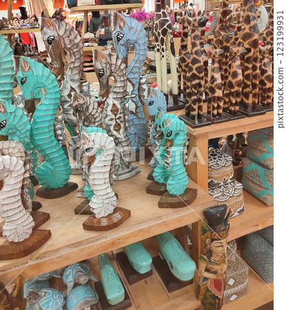 Bunch of handmade wood crafted souvenirs figurines of Balinese traditional style Bunch of handmade wood crafted souvenirs figurines of Balinese traditional style 123199931