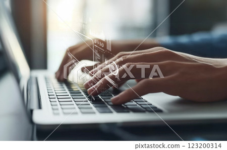 Professional hands typing on a laptop with digital business data analytics and marketing strategy graphics overlaid in a modern office setting XDMCP 123200314