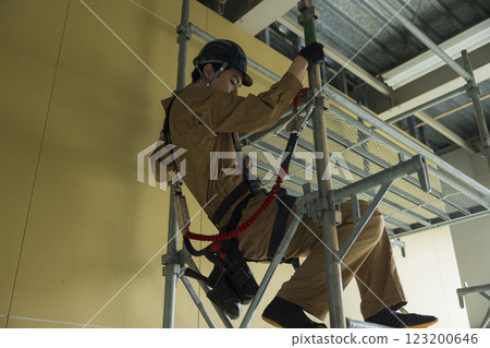 A man working at a construction site A man working at a construction site 123200646