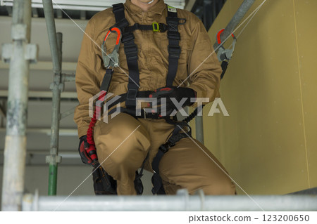 A man working at a construction site A man working at a construction site 123200650