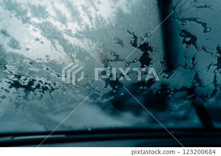 Frozen Vision (view through a windshield in winter) 123200684