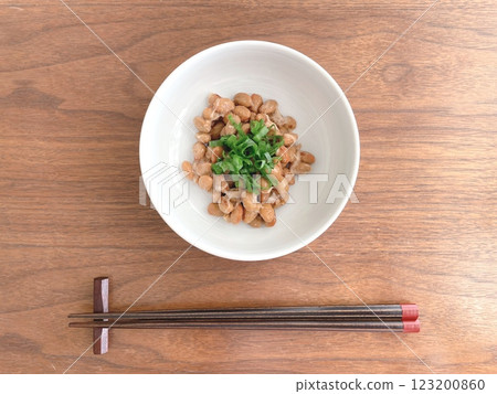 Natto with green onions and chopsticks on a table Natto with green onions and chopsticks on a table 123200860