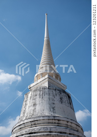 Upward view of a white pagoda set against a clear blue sky Upward view of a white pagoda set against a clear blue sky 123201211
