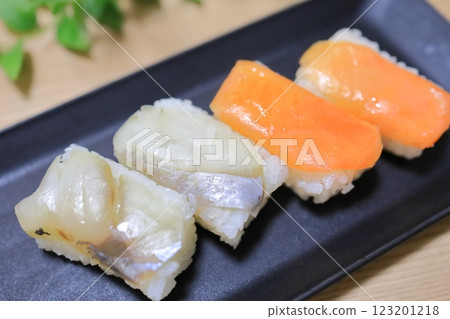 Persimmon leaf sushi on a plate 123201218