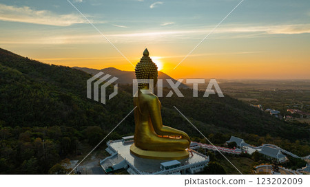 Aerial view of the Golden big Buddha Statue at Sunset. Aerial view of the Golden big Buddha Statue at Sunset. 123202009