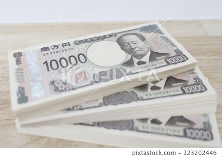 A stack of 3 million yen bills A stack of 3 million yen bills 123202446