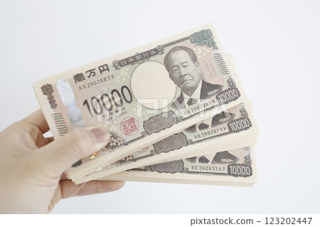 A stack of 3 million yen bills A stack of 3 million yen bills 123202447