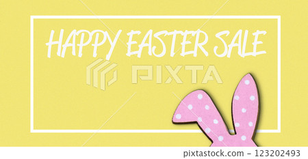 Yellow background with a pink rabbit on it 123202493
