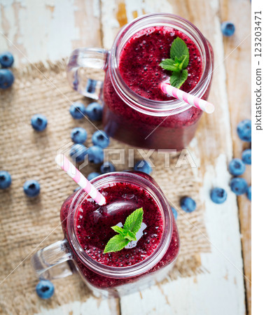 Berry smoothie on wooden table 123203471