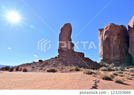 "The Thumb" towering over the scorching hot Monument Valley "The Thumb" towering over the scorching hot Monument Valley 123203660