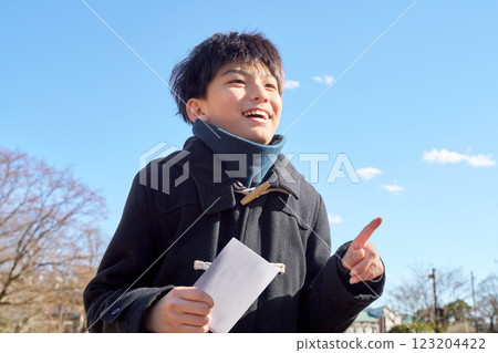 A male student smiles after seeing the results 123204422