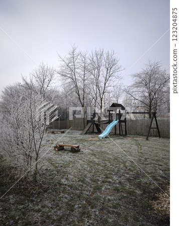 Playground covered in frost on a cold december morning in prague Nature park Smetanka Playground covered in frost on a cold december morning in prague Nature park Smetanka 123204875
