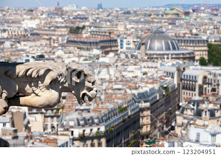 Gargoyle atop of the Tour St Jacques in Paris Gargoyle atop of the Tour St Jacques in Paris 123204951