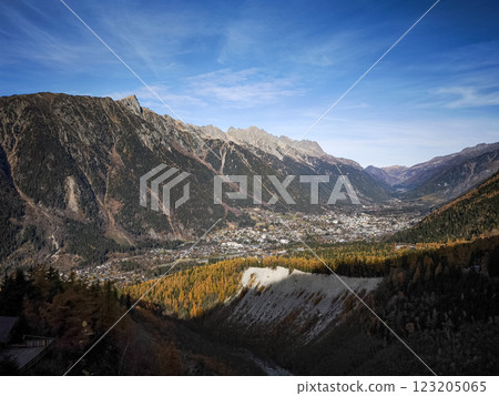 Chamonix valley basking in the november sun with colorful larch trees and rugged mountains Chamonix valley basking in the november sun with colorful larch trees and rugged mountains 123205065