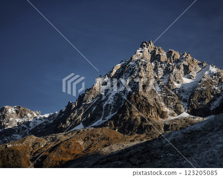 Aiguille du midi mountain peak Mont Blanc towering over chamonix valley in autumn 123205085