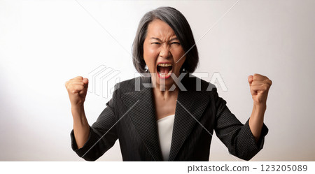 Angry middle-aged woman with a scary face Angry middle-aged woman with a scary face 123205089