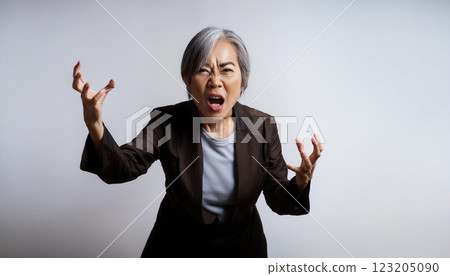 Angry middle-aged woman with a scary face Angry middle-aged woman with a scary face 123205090