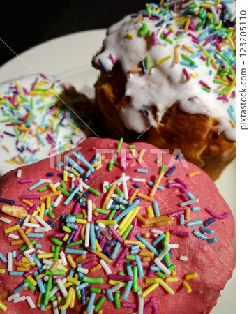 Three easter cakes bread Kulich from czech republic with colorful sprinkles and white icing 123205110