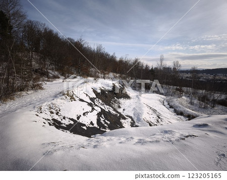Snow limestone quarry overlooking prague skyline during winter season Nature Reserve Cihelna v Bazantnici, Hloubetin Snow limestone quarry overlooking prague skyline during winter season Nature Reserve Cihelna v Bazantnici, Hloubetin 123205165