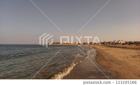Gentle waves of red sea washing marsa alam beach in egypt at sunset Gentle waves of red sea washing marsa alam beach in egypt at sunset 123205166