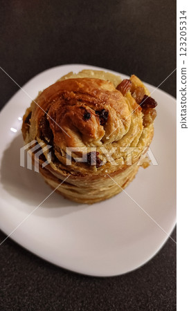 Golden easter bread adorned with raisins, celebrating festive springtime traditions copy space Golden easter bread adorned with raisins, celebrating festive springtime traditions copy space 123205314