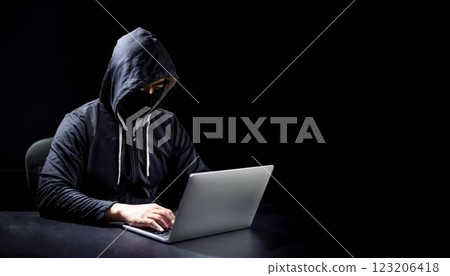 Criminal using a laptop. 123206418