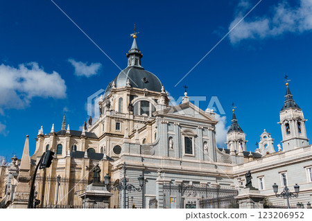 Majestic view of the Almudena Cathedral dome rising against a clear blue sky in Madrid. 123206952