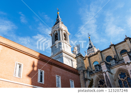 The Almudena Cathedral soars against the blue sky in Madrid, showcasing Spanish architecture. 123207246