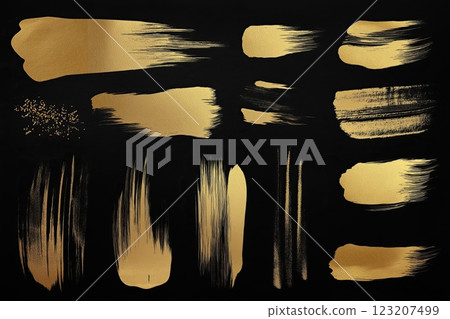Set of gold paint brush strokes isolated on black background. Golden grunge texture. 123207499