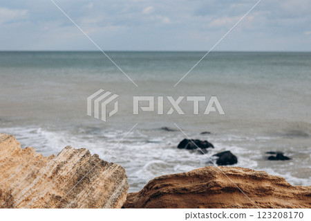 Early morning sunrise over the sea . Some clouds. 123208170