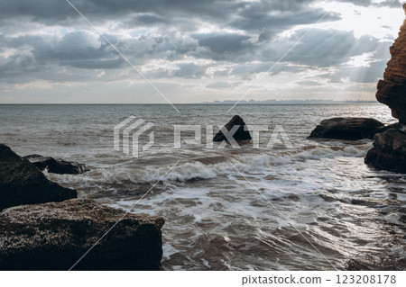 Early morning sunrise over the sea . Some clouds. 123208178